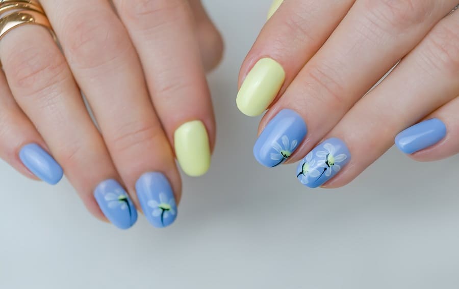 light blue nails with white flowers