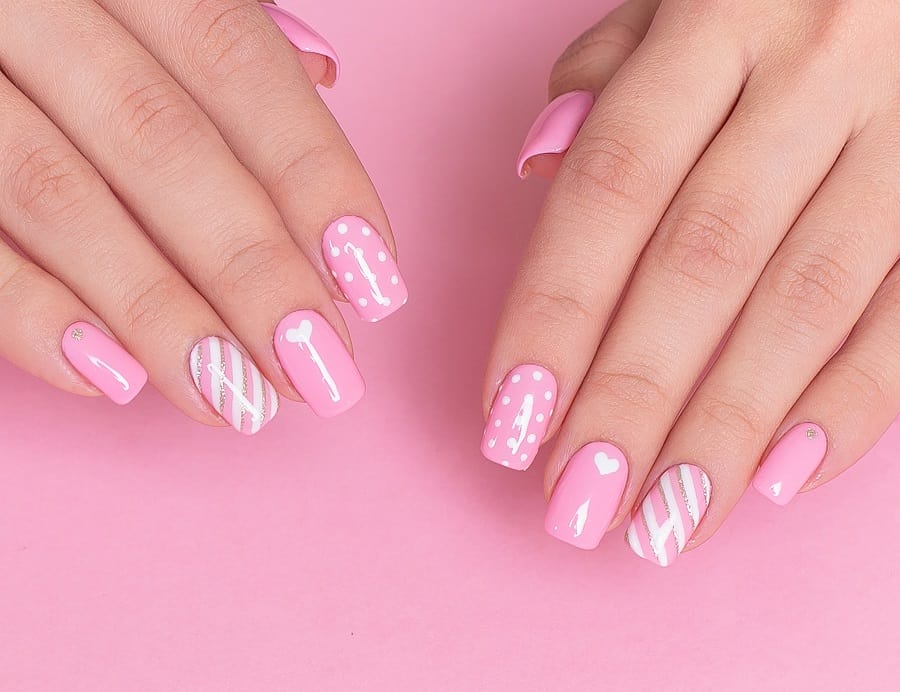 pink and white nails with design