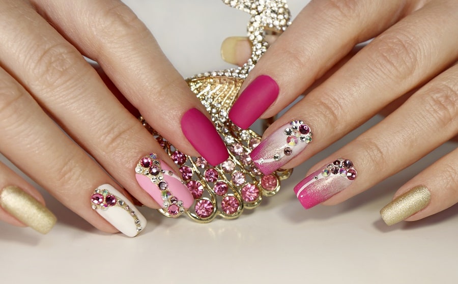 pink and white nails with rhinestones