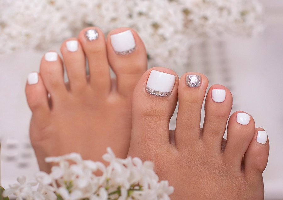 white and silver toe nail design