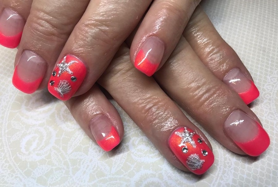 coral nails with rhinestones