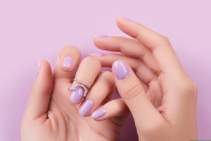 Pastel purple nail design with a glossy finish.