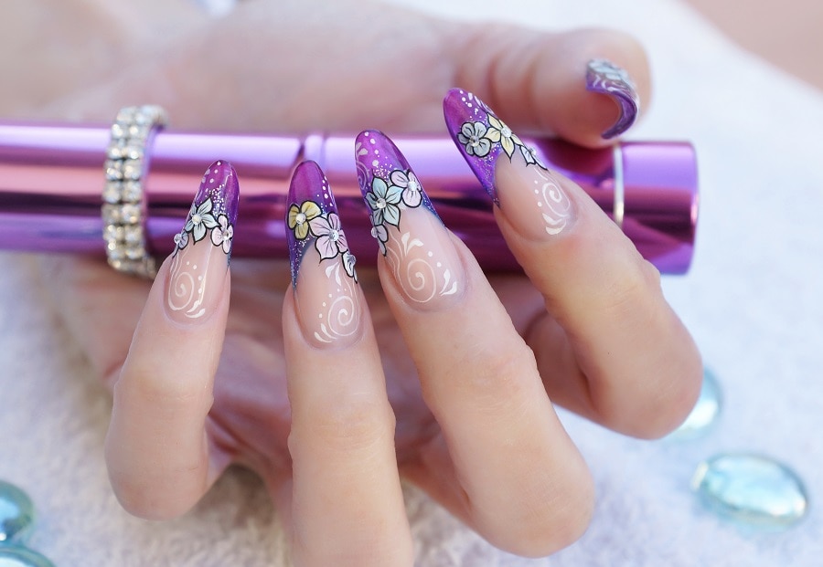 purple stiletto nails with flower design