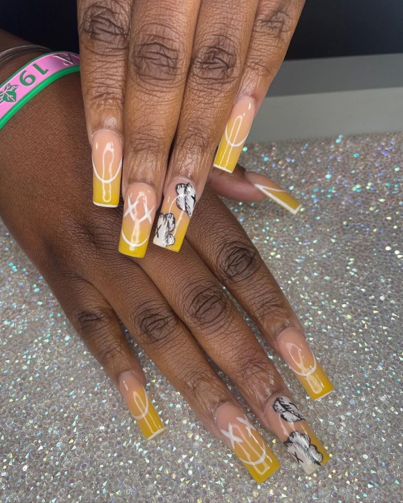 acrylic yellow nails on dark skin