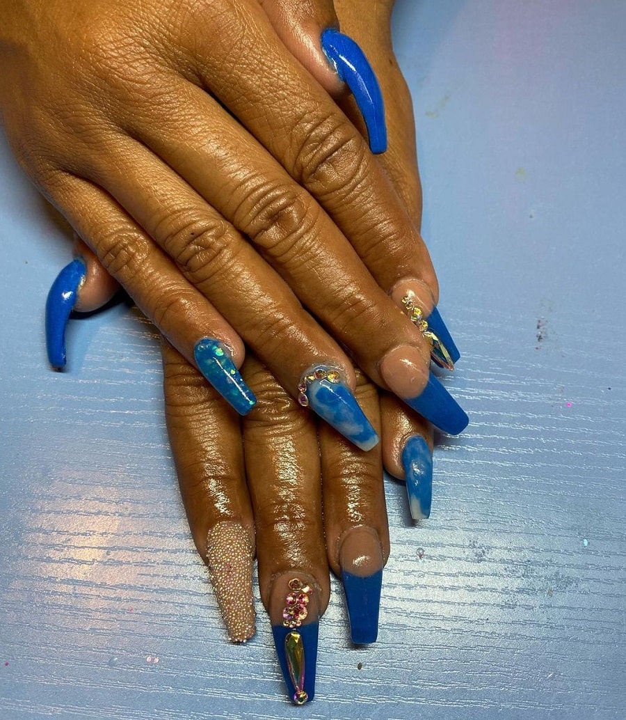 blue coffin nails with rhinestones on dark skin