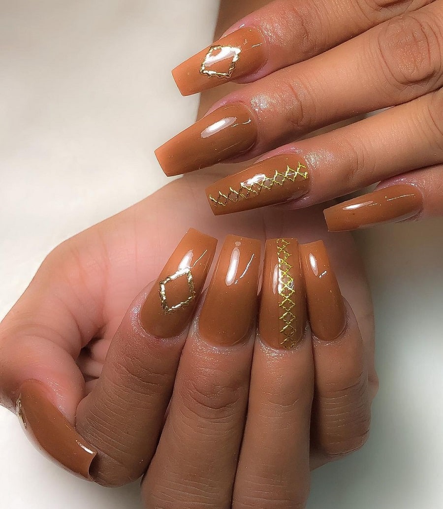 brown coffin nails on dark skin