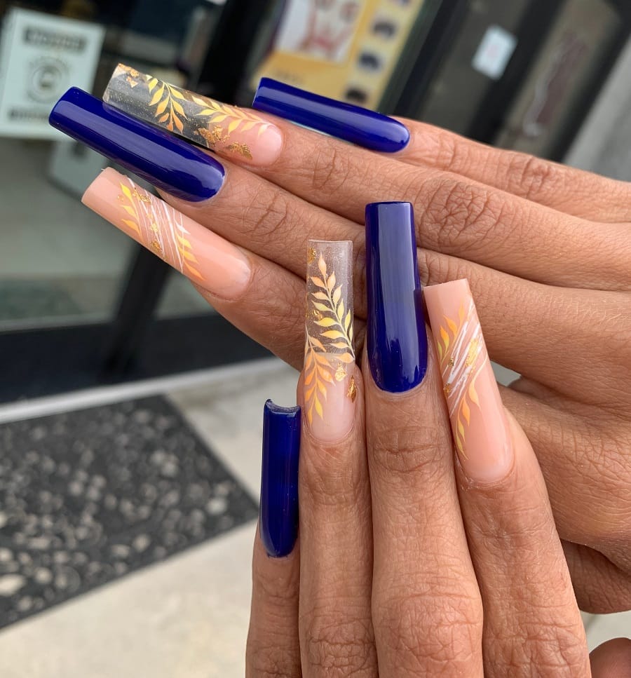 dark blue and nude coffin nails on dark skin