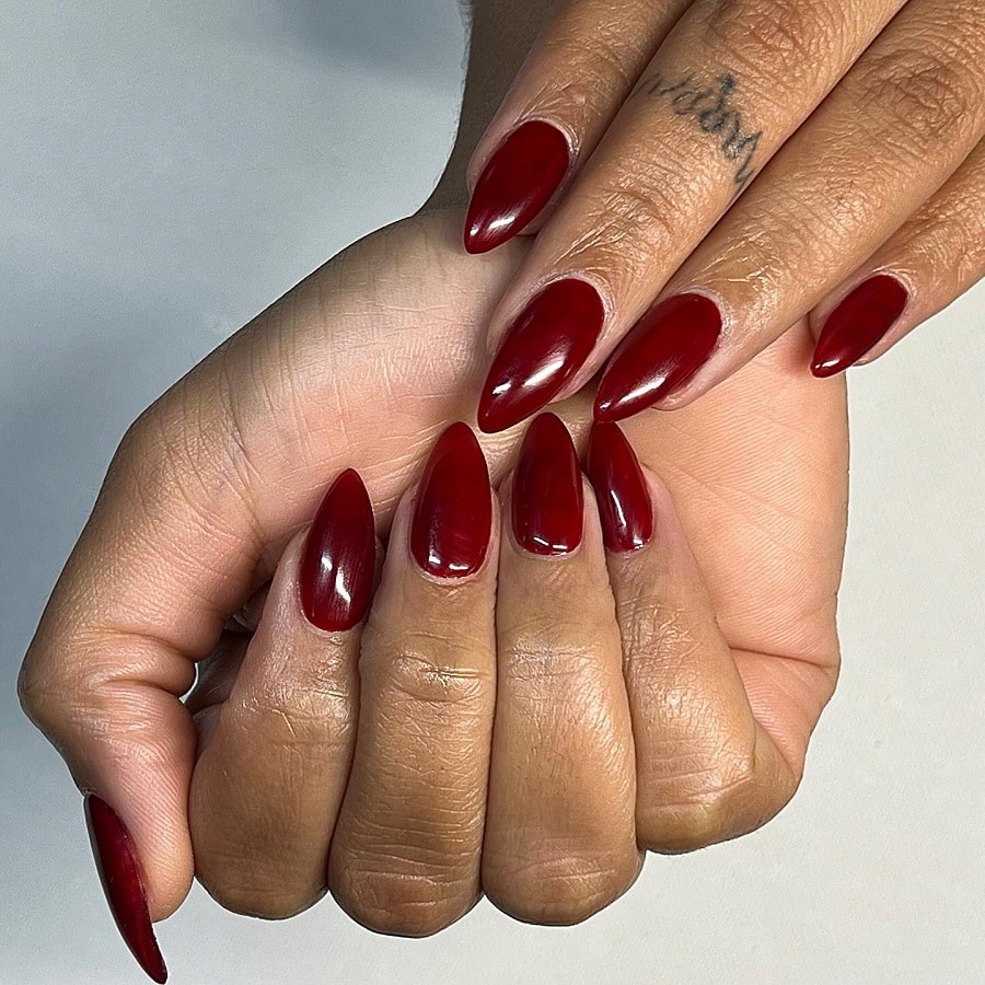 dark red nails on dark skin