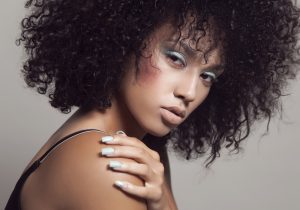 Pastel blue nails with matte finish and subtle shimmer.