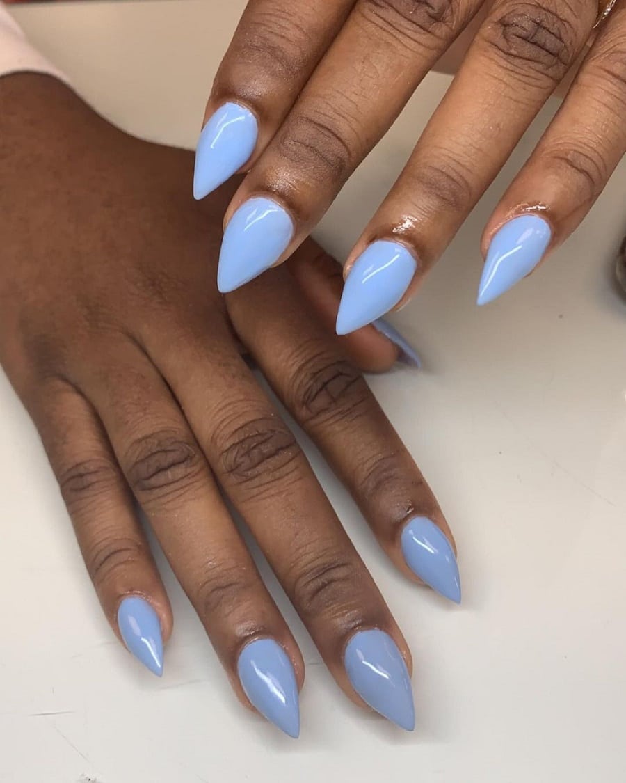 light blue stiletto nails on dark skin