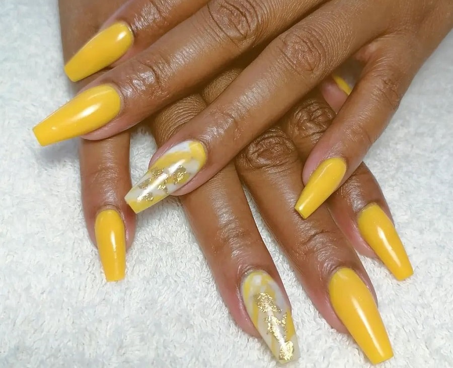 long yellow nails on dark skin