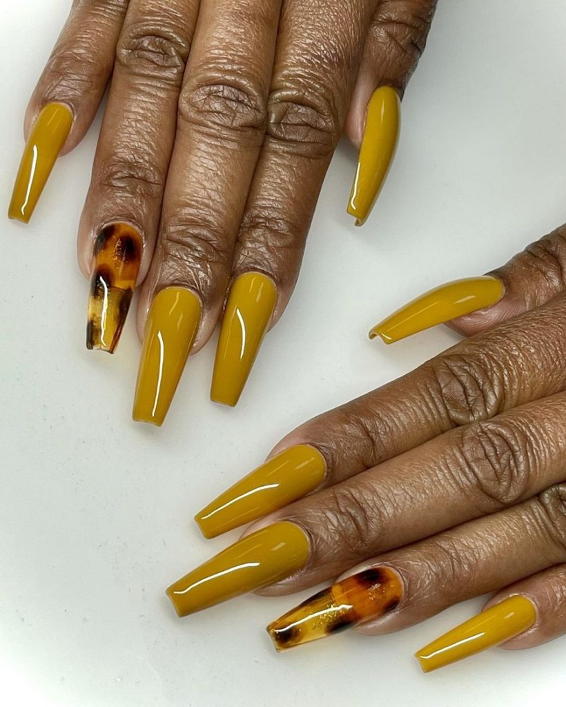 mustard yellow nails on dark skin