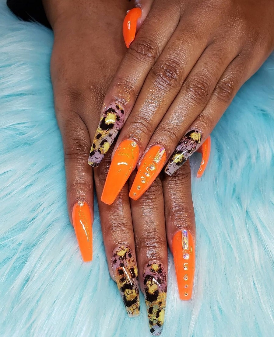 orange coffin nails on dark skin