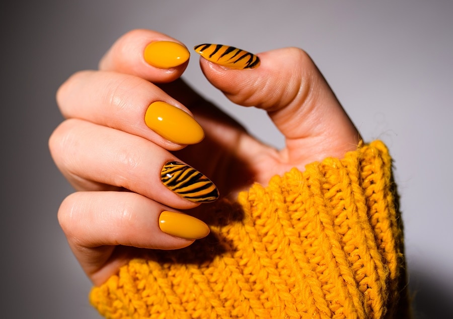 orange nail design for cool skin tone