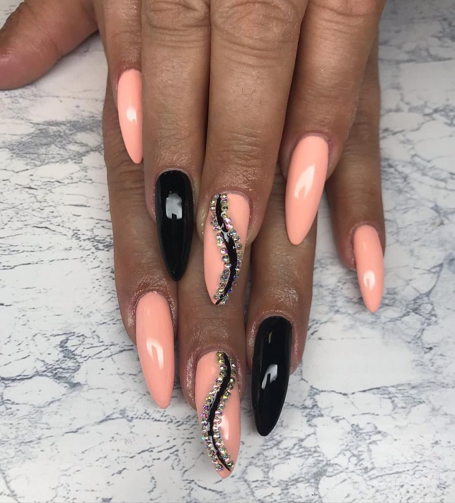 peach and black nails on dark skin