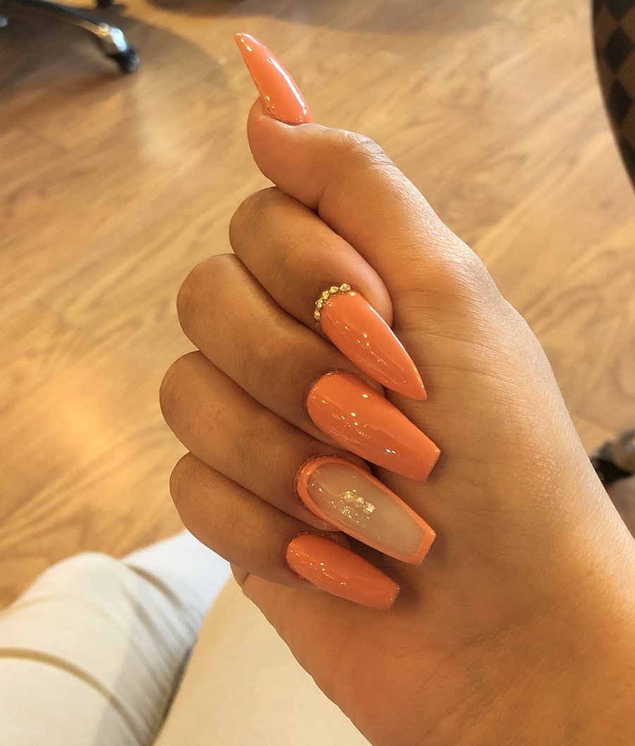 orange french coffin nails on dark skin