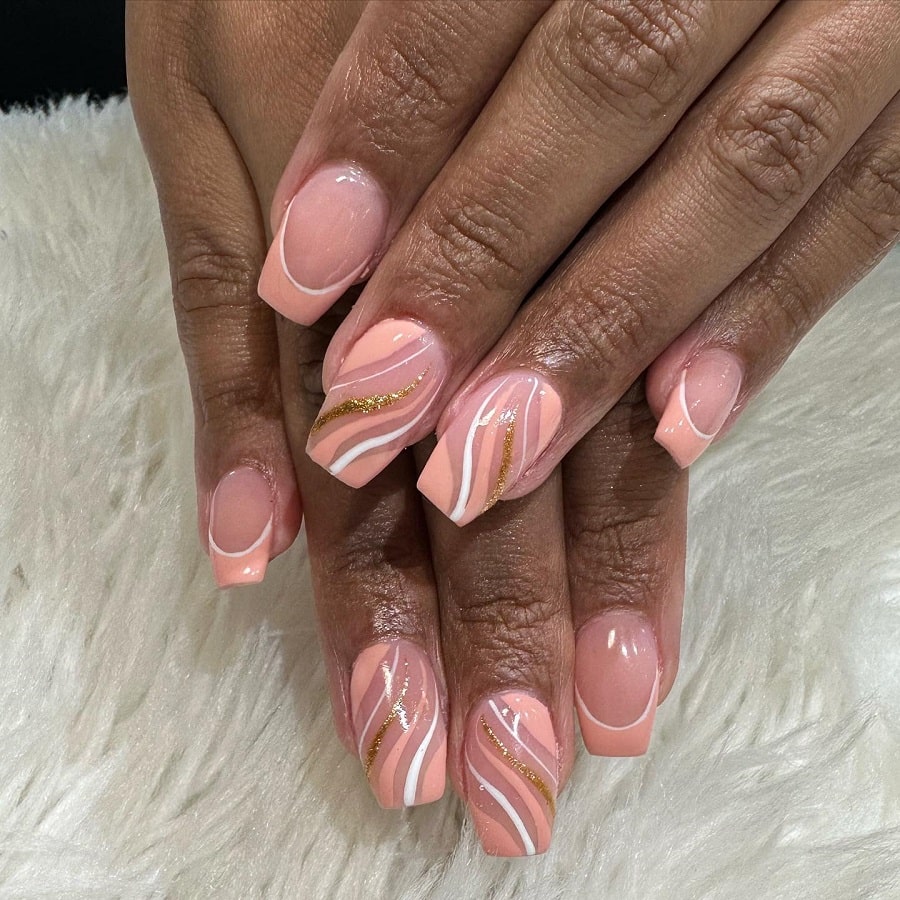 peach color french nails on dark skin