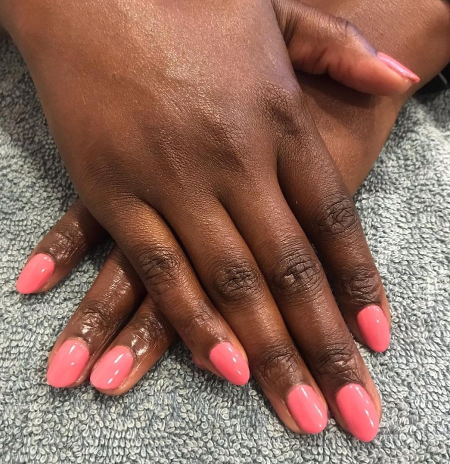 peach color oval nails on dark skin