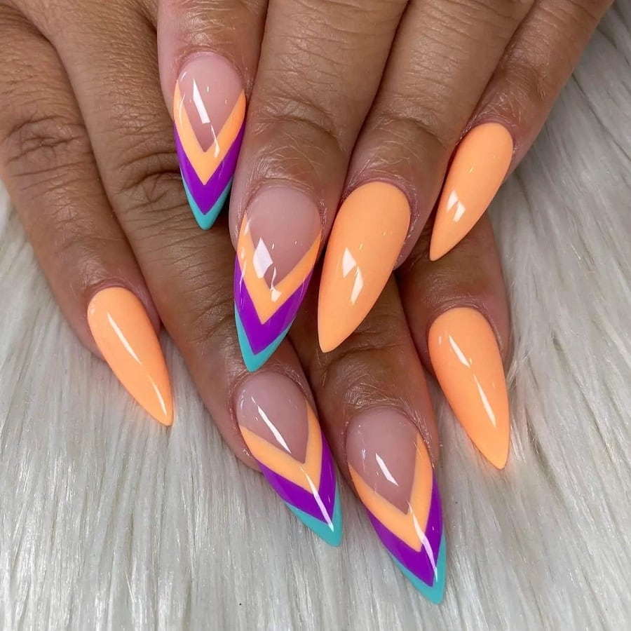 peach color stiletto nails on dark skin