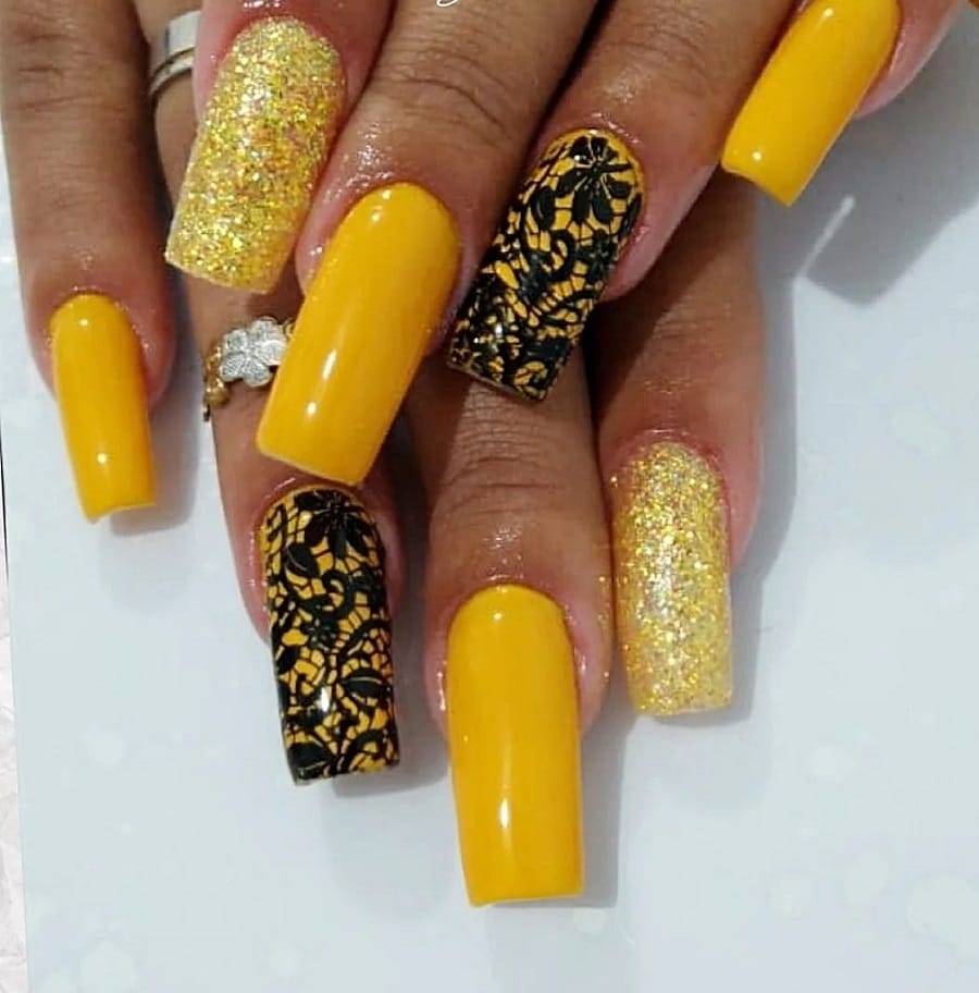 yellow and black nails on dark skin
