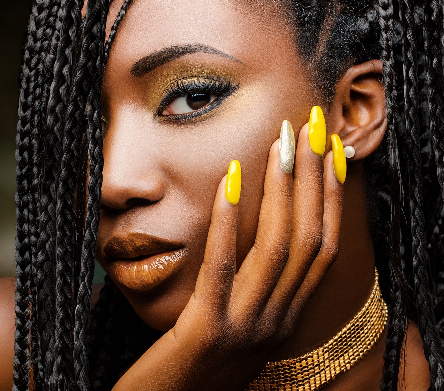 yellow gel nails on dark skin