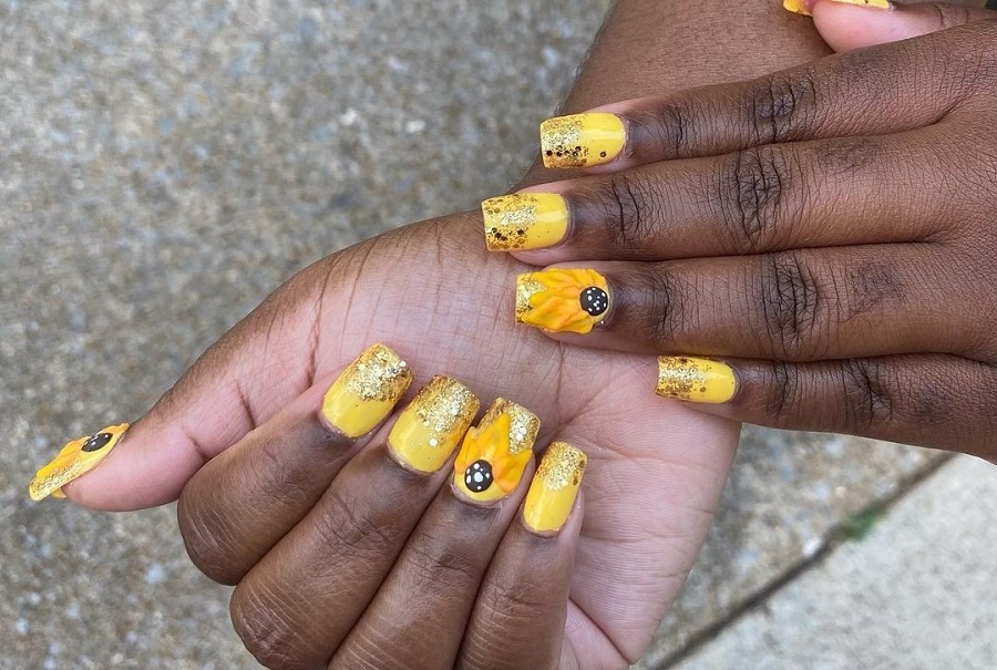 yellow sunflower nails on dark skin