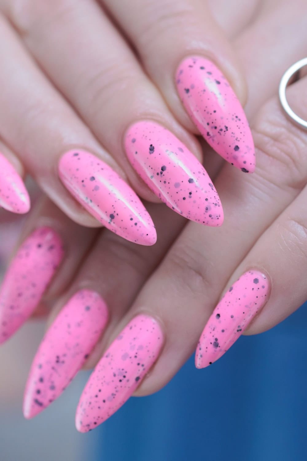 pink with black dots acrylic nails